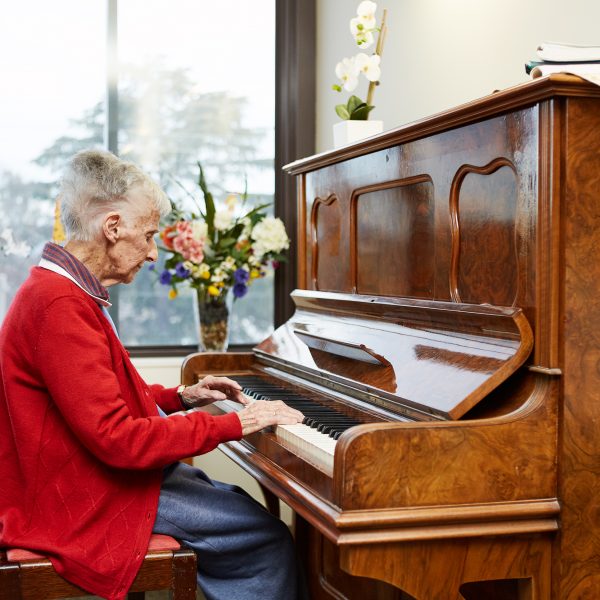 One of our residents playing the piano at Mercy Place Albury.